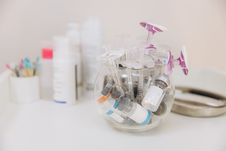 Medical syringes and hyaluronidase vials.